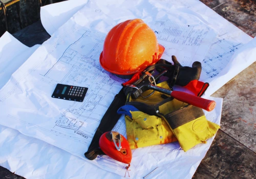 Construction job site tools and blueprints - managed IT services for contractors, electricians, plumbers and tradesmen