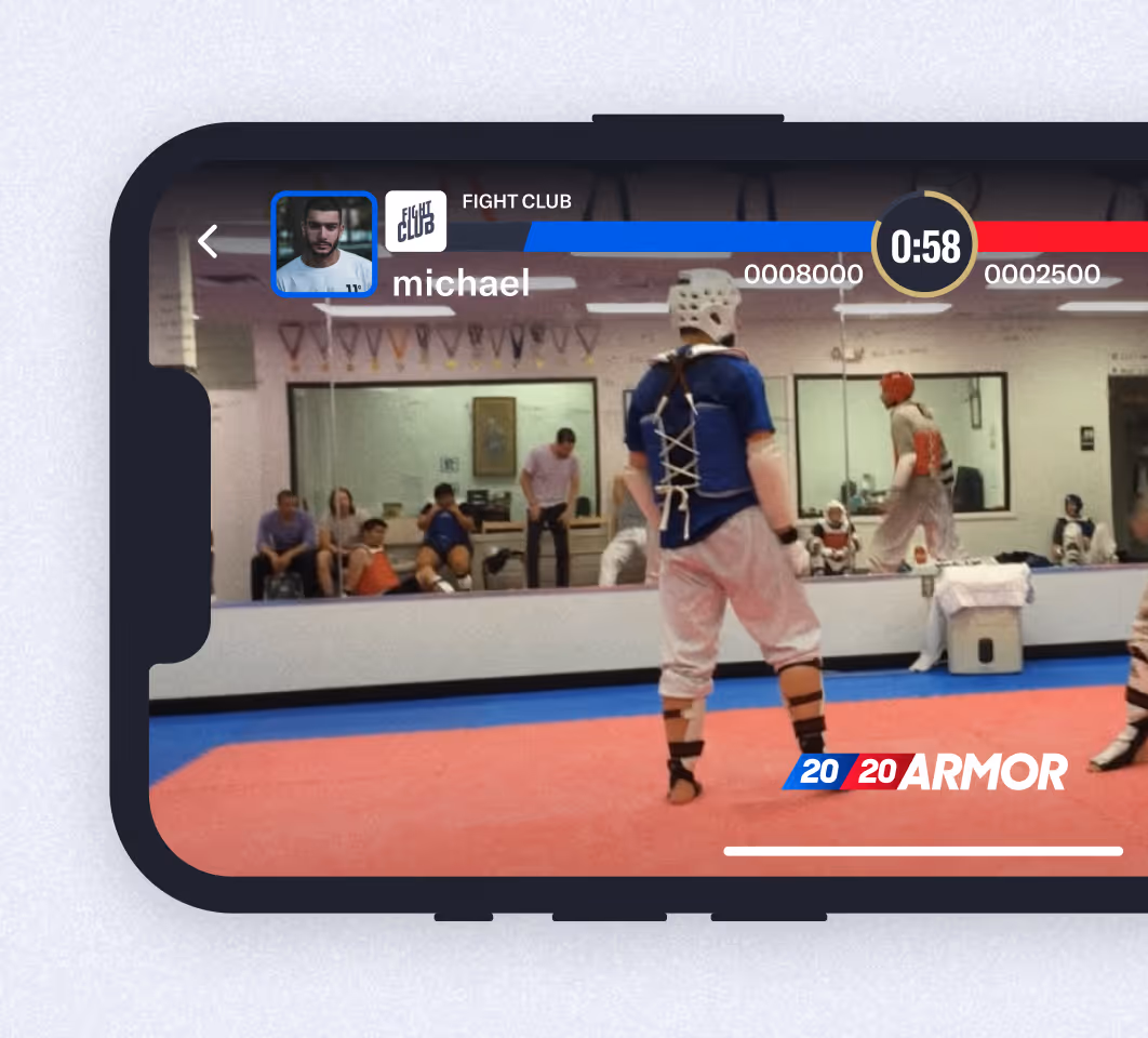 Mobile screen showing a Fight Club game with two fighters wearing protective gear in a gym.
