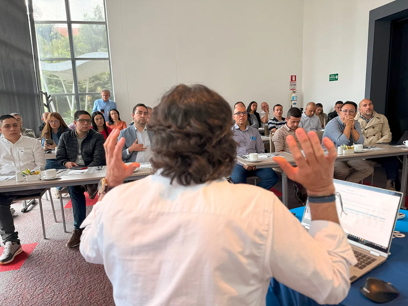 r-daniel CTO, Oscar Ramos in a conference