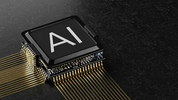 Chip connected with gold lines with AI letters on it