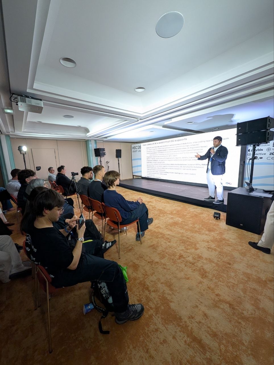 George V. delivering Hackseasons Cannes keynote on decentralized AI as a public good