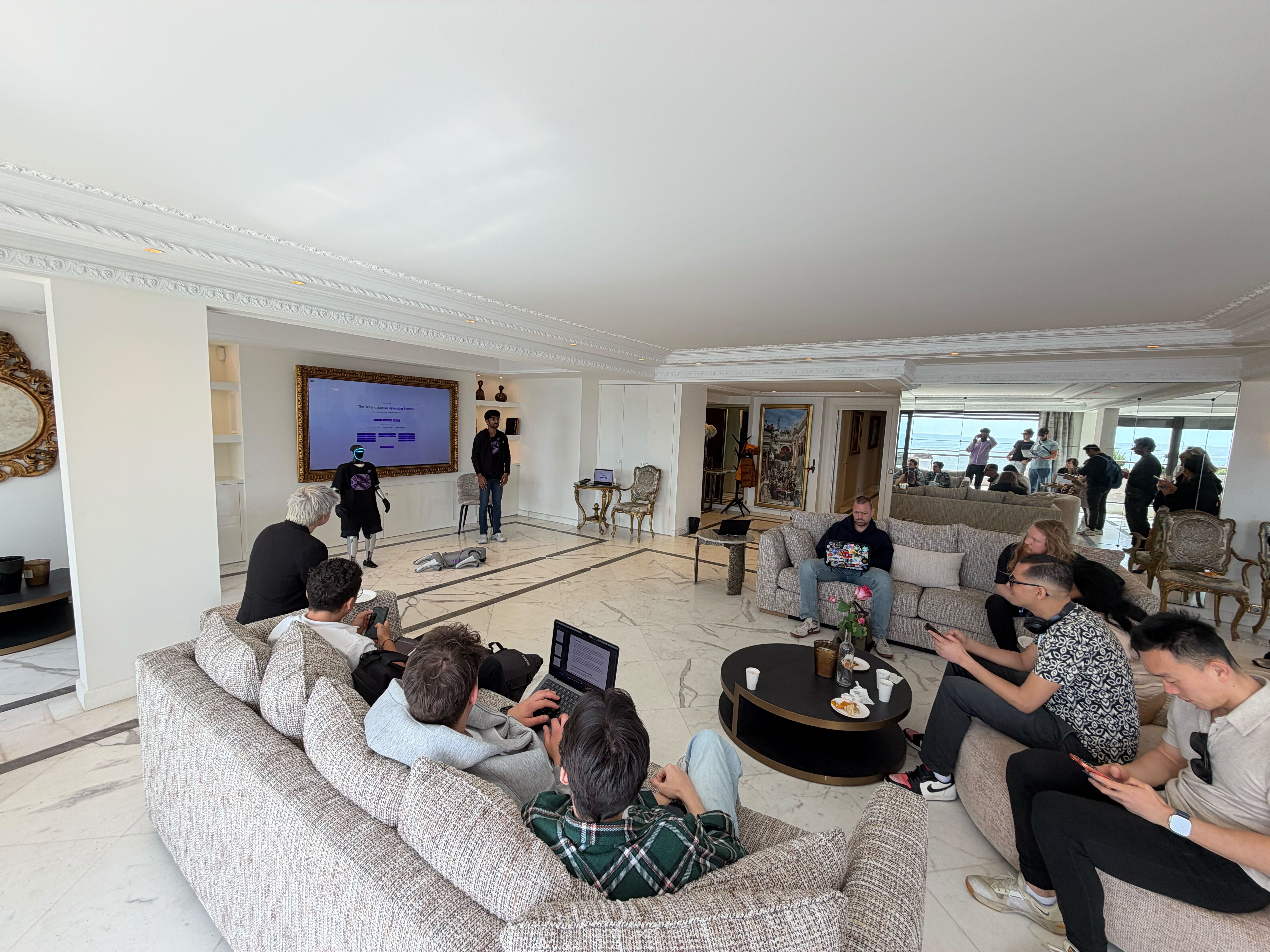 Builders Villa open house at Dev's Villa with developers working on laptops, sea view in background