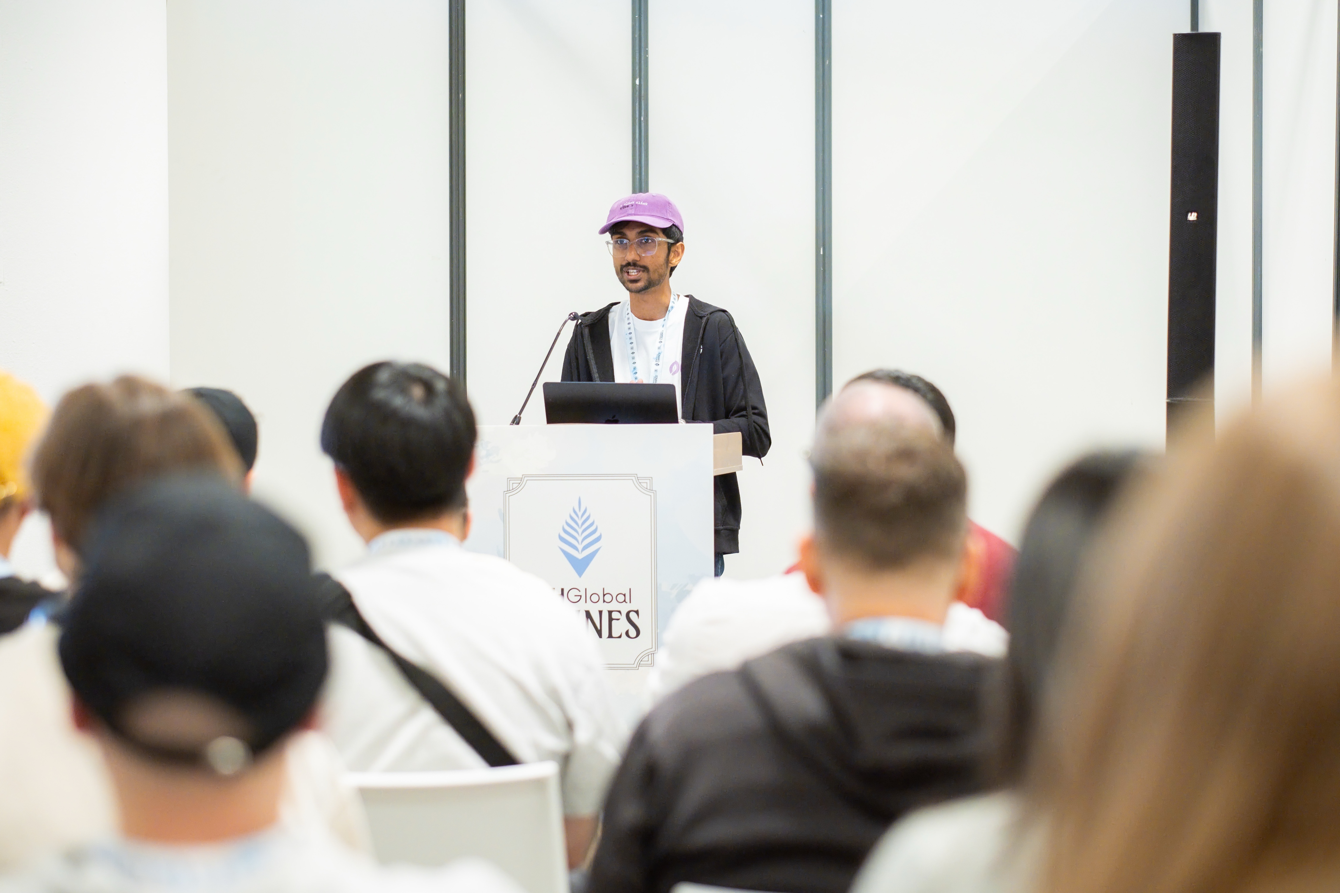 Gathin T. delivering Building AI Agents the Web3 Way workshop at ETHGlobal Cannes podium