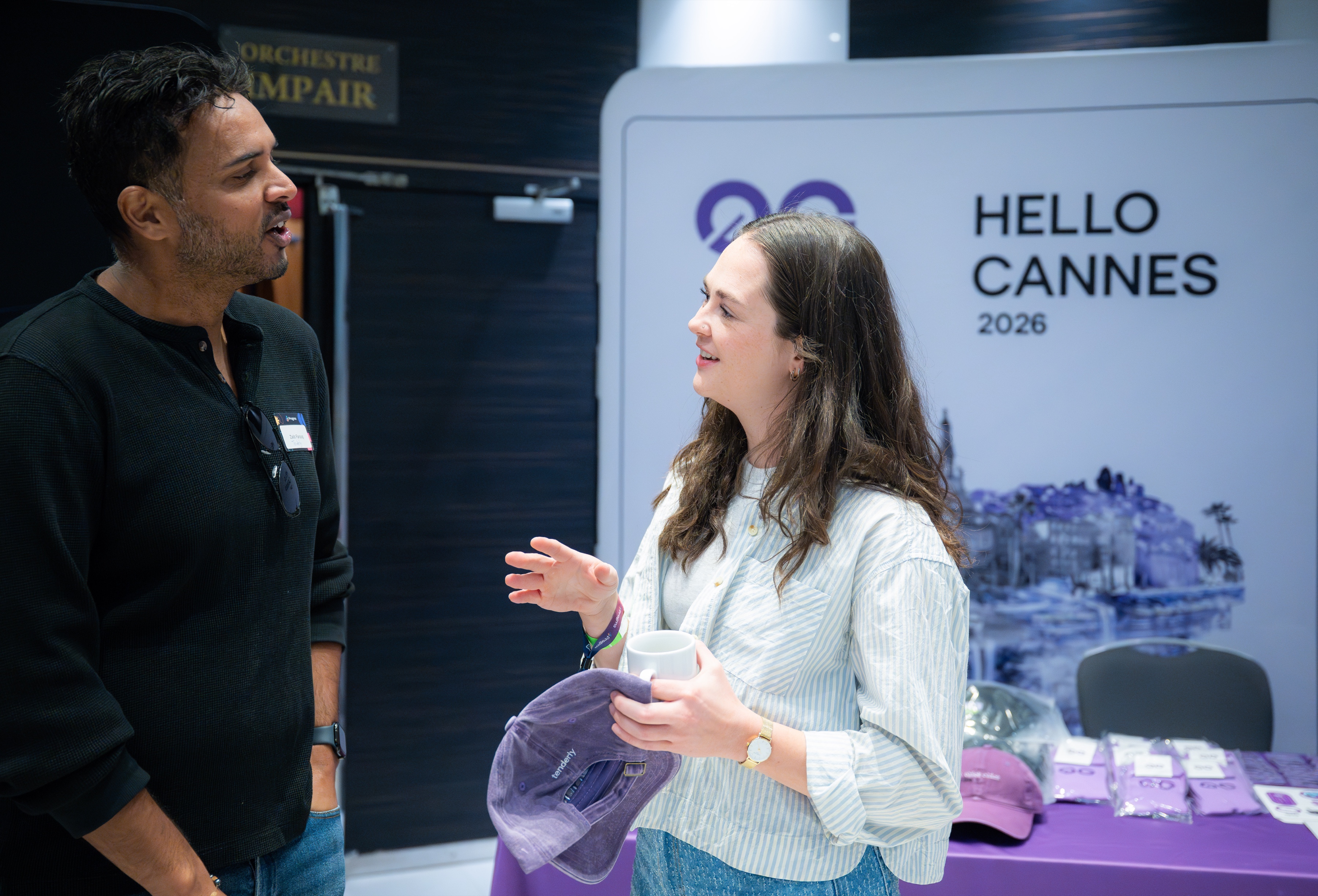 0G team networking at Pragma by ETHGlobal booth in front of Hello Cannes 2026 backdrop