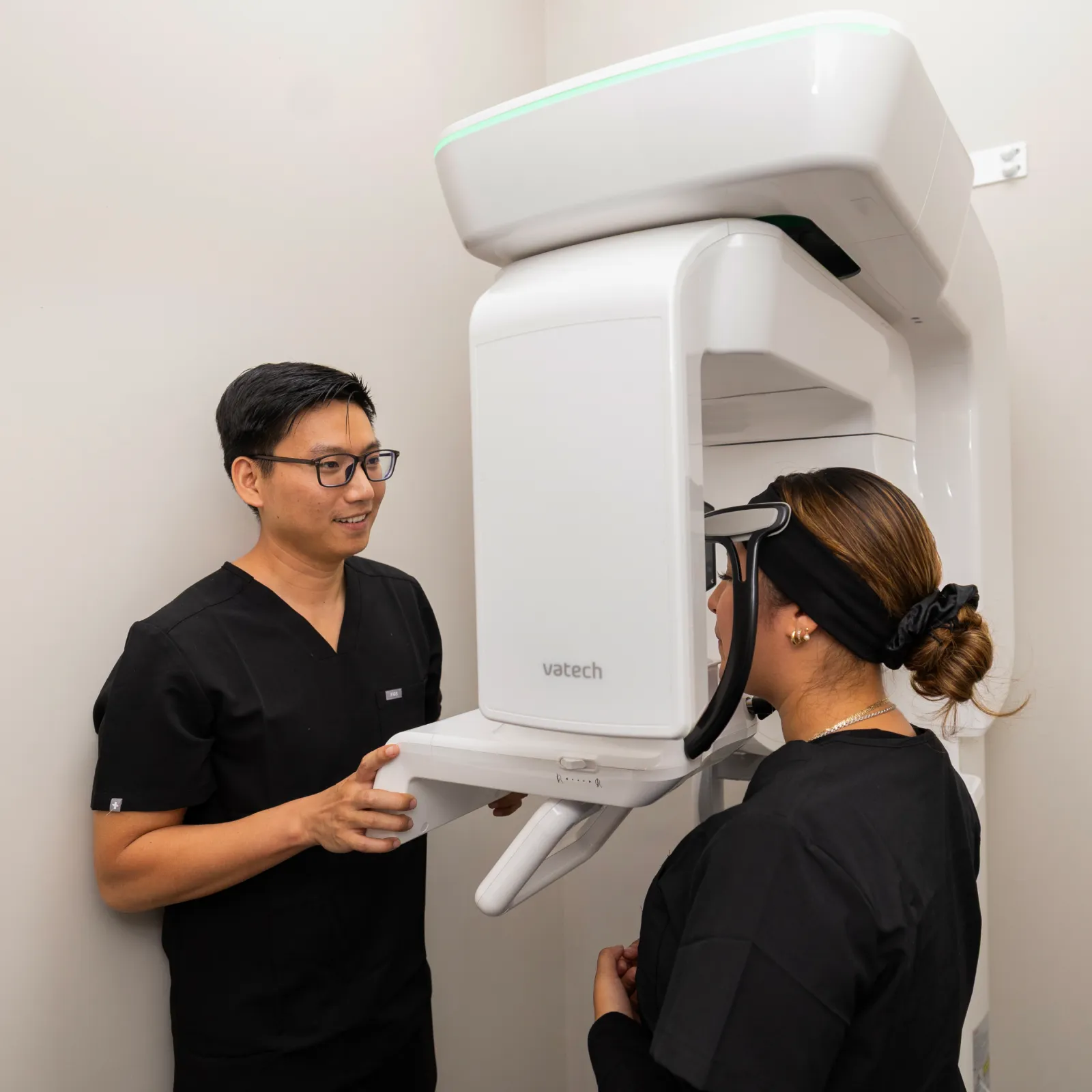 Dr. Huynh getting x-rays to patient