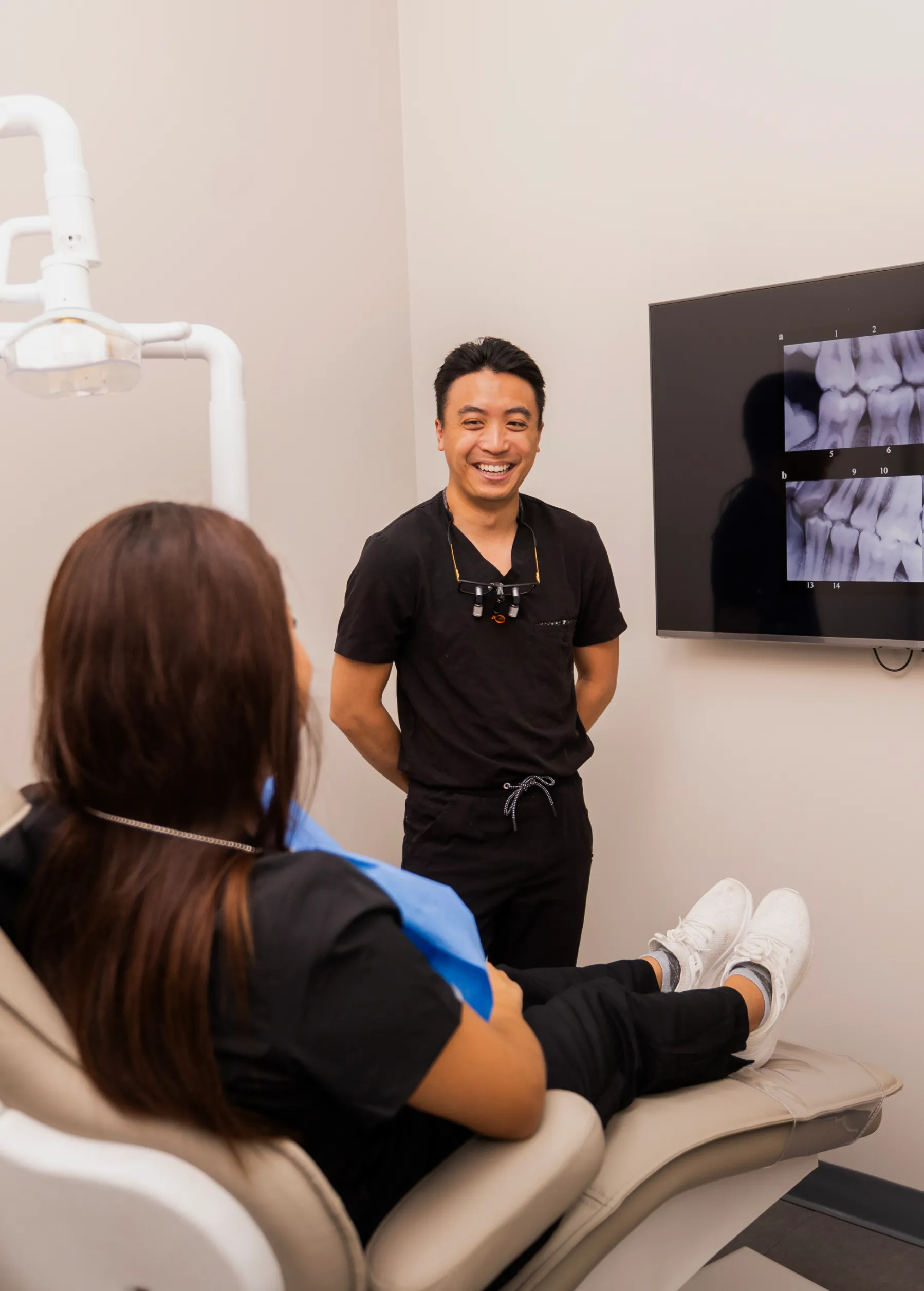 Dr. Bui showing x-ray to patient