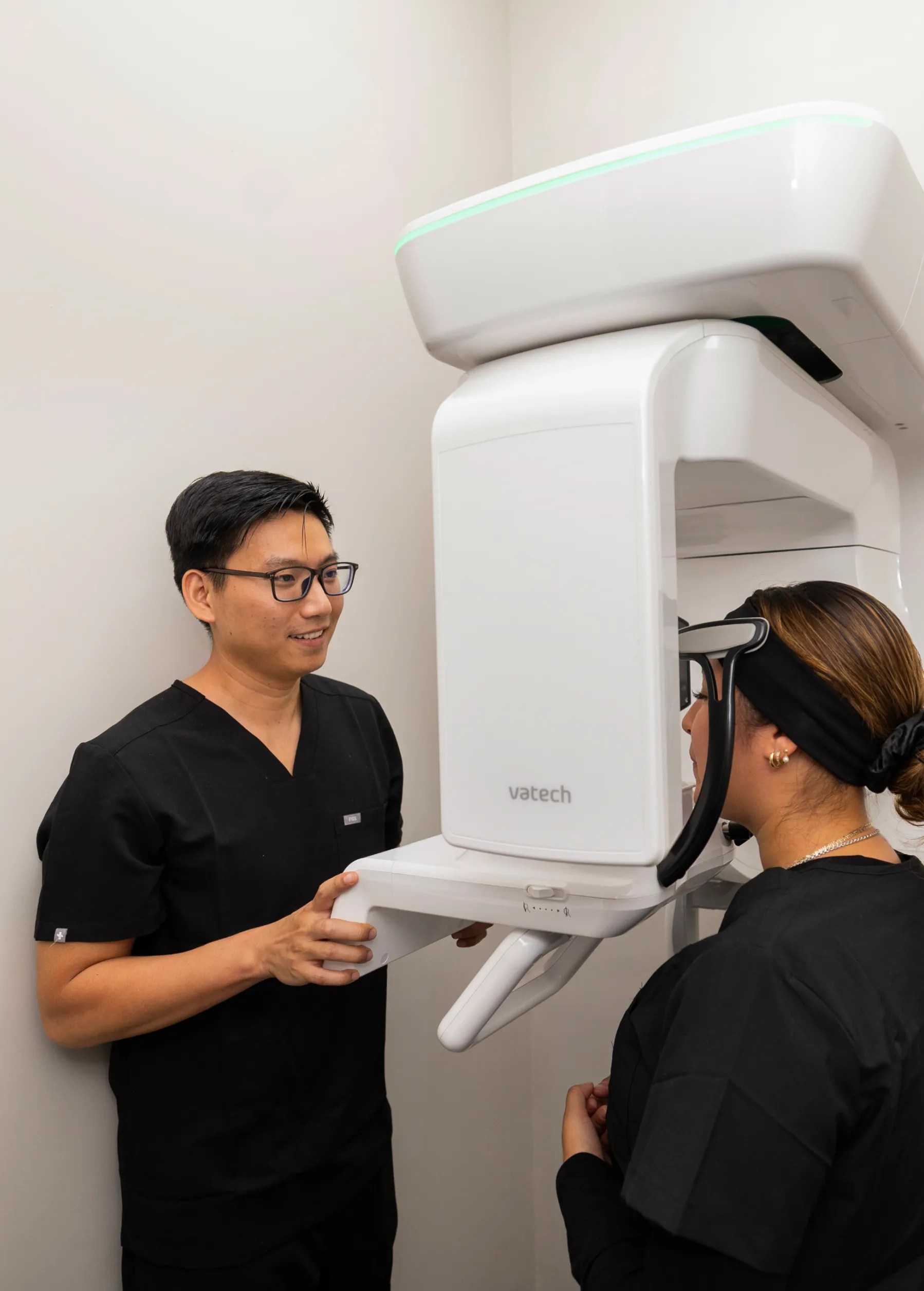 Dr. Huynh getting x-rays to patient
