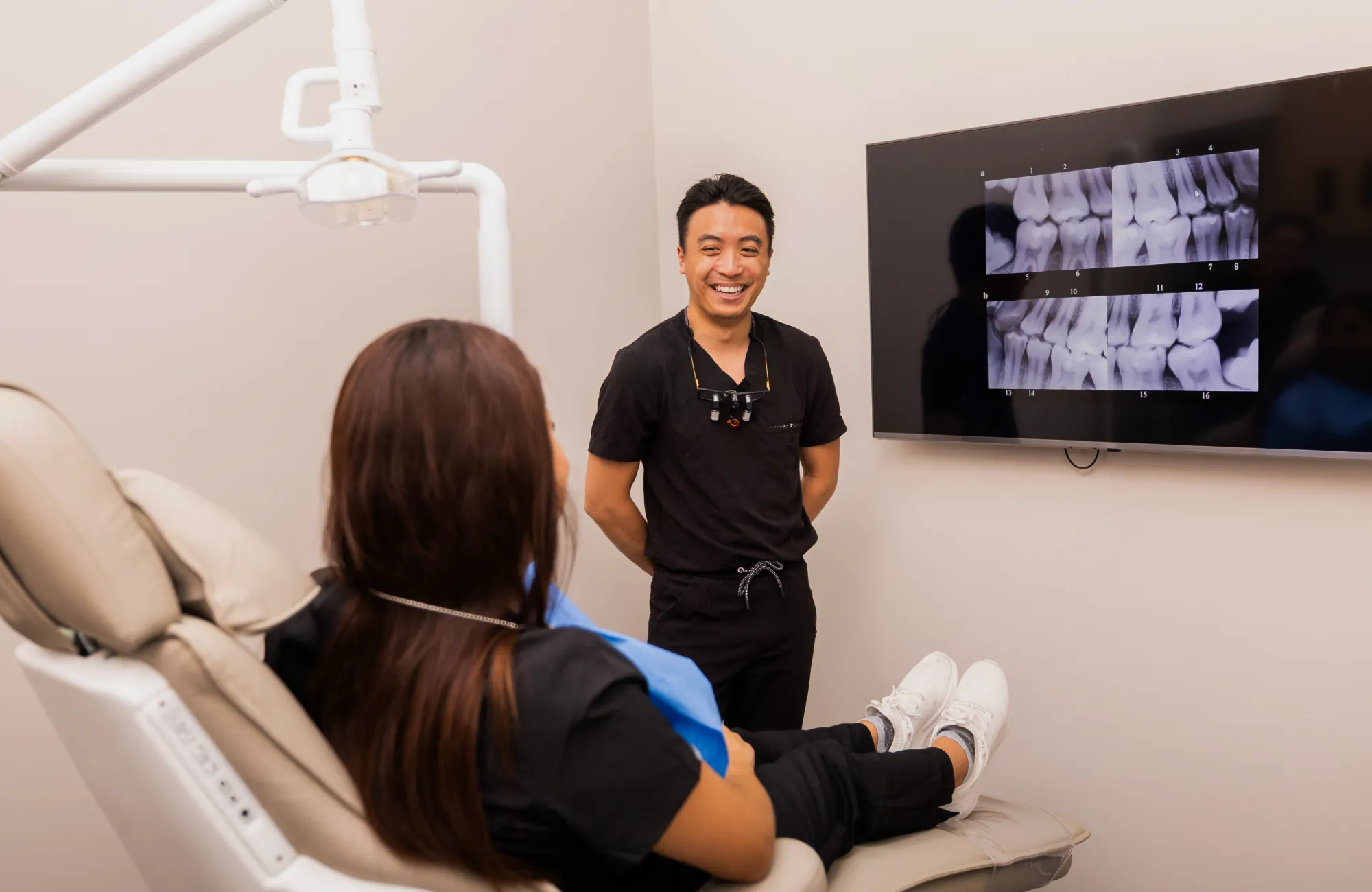 Dr. Bui showing x-ray to patient