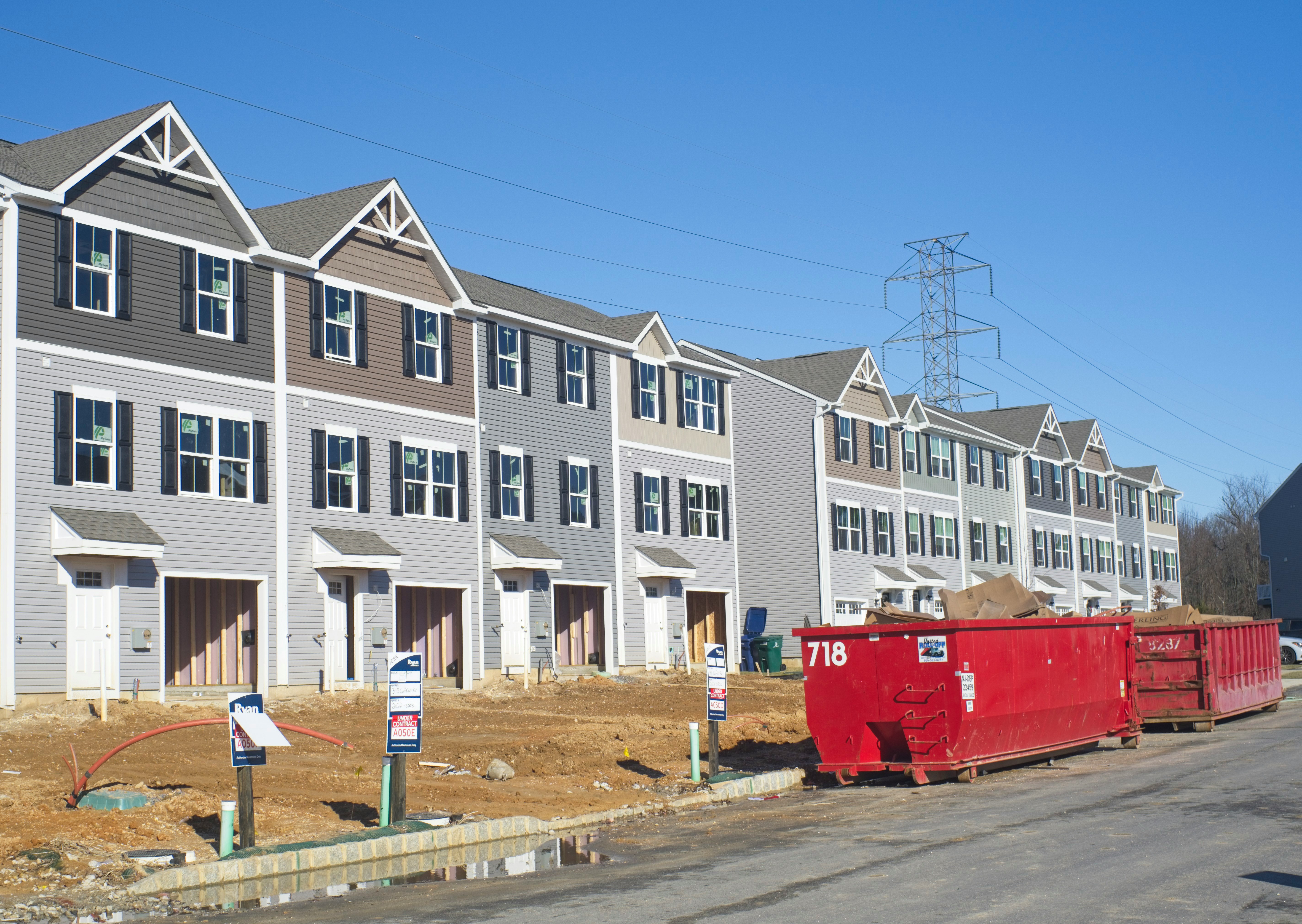 Detached ADU with black siding and clerestory windows
