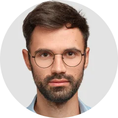 A man with glasses and a beard.