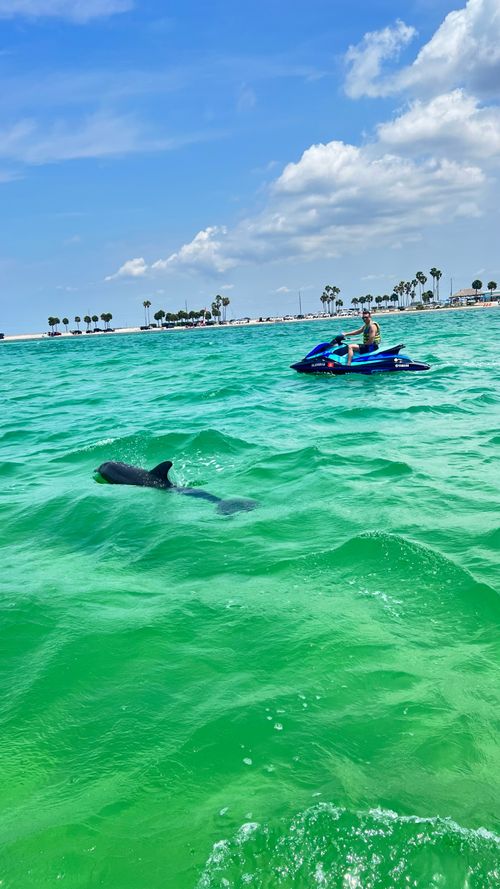 Guest relaxing on a boat ride in the clear waters off Clearwater Beach
