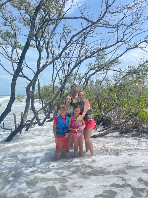 Guests enjoying a sunny day on the clear waters of Clearwater Beach