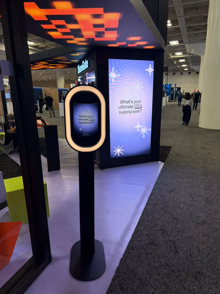 Live LED gallery wall displaying AI generated video results at ShareGate event booth