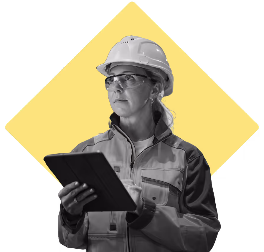 Woman with a hardhat listening to an announcement