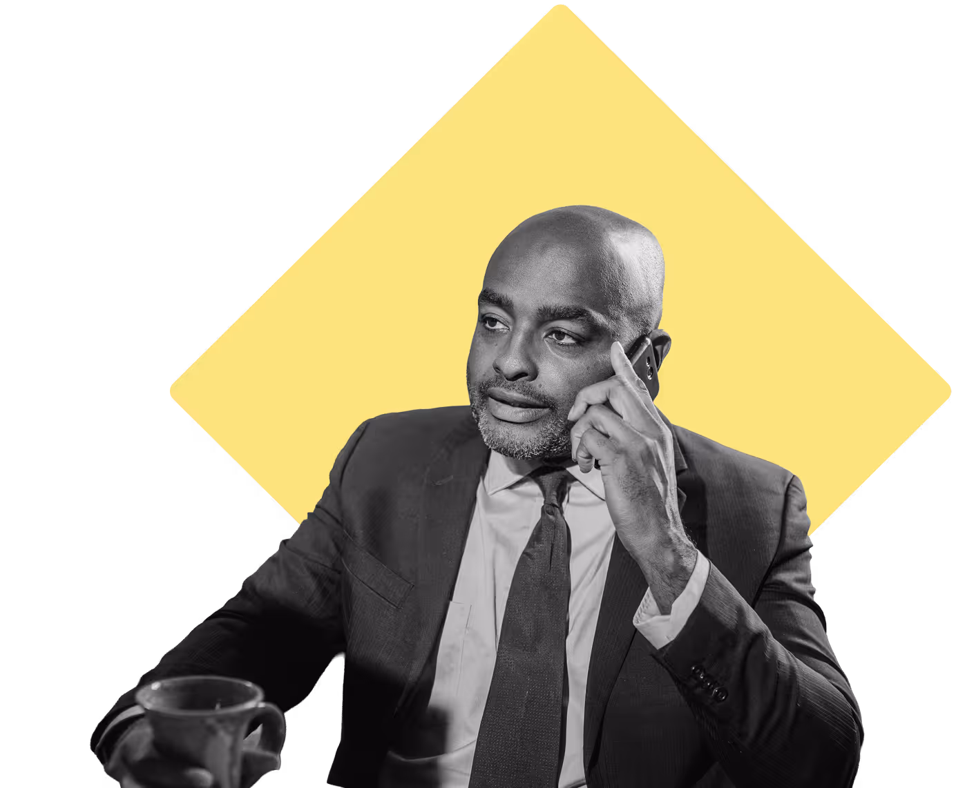 Principal on the phone with a coffee in hand