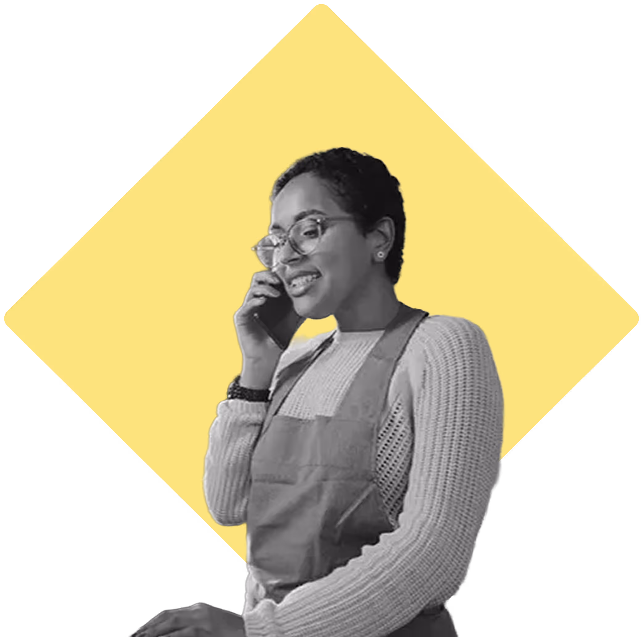 Woman wearing an apron taking a phone call