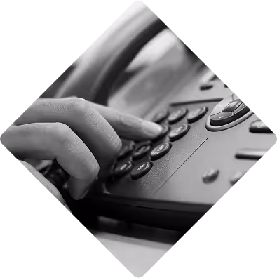 Hand dialling a number on a business phone