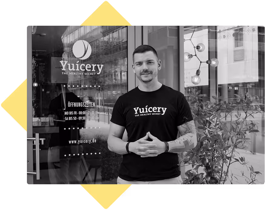 Restaurant owner standing in front of his restaurant