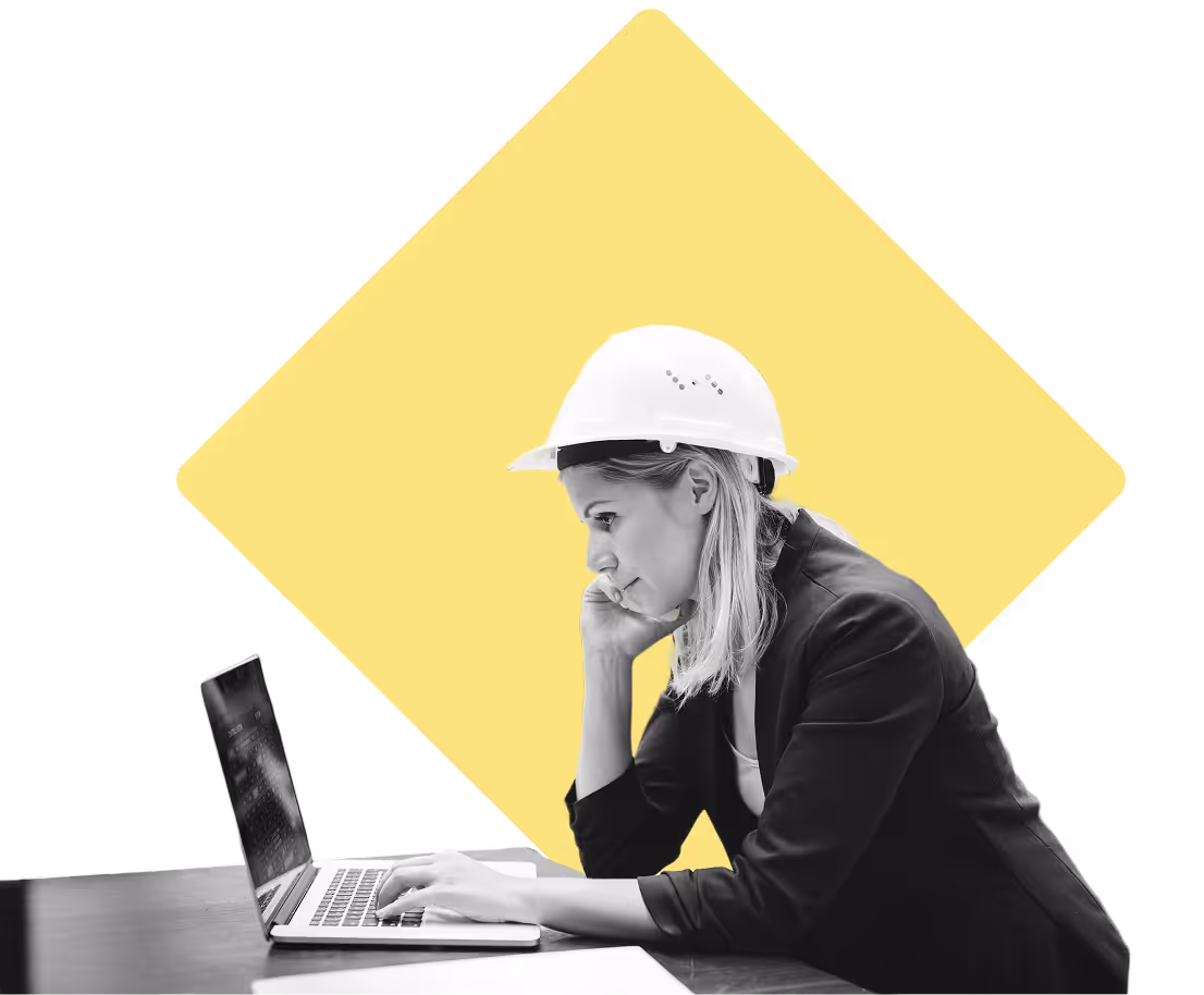 Woman in manufacturing typing on her laptop