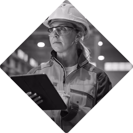 Woman with a hardhat holding a tablet