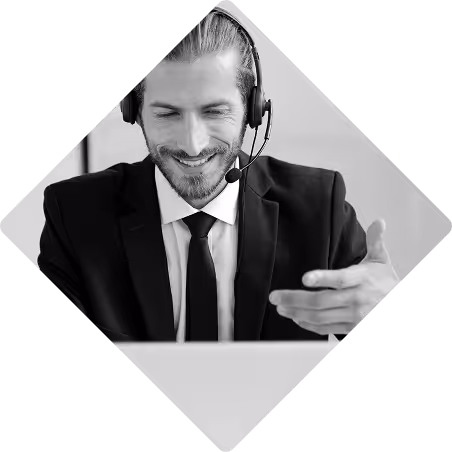 Business man on a Microsoft Teams meeting, on his laptop, with a headset on.