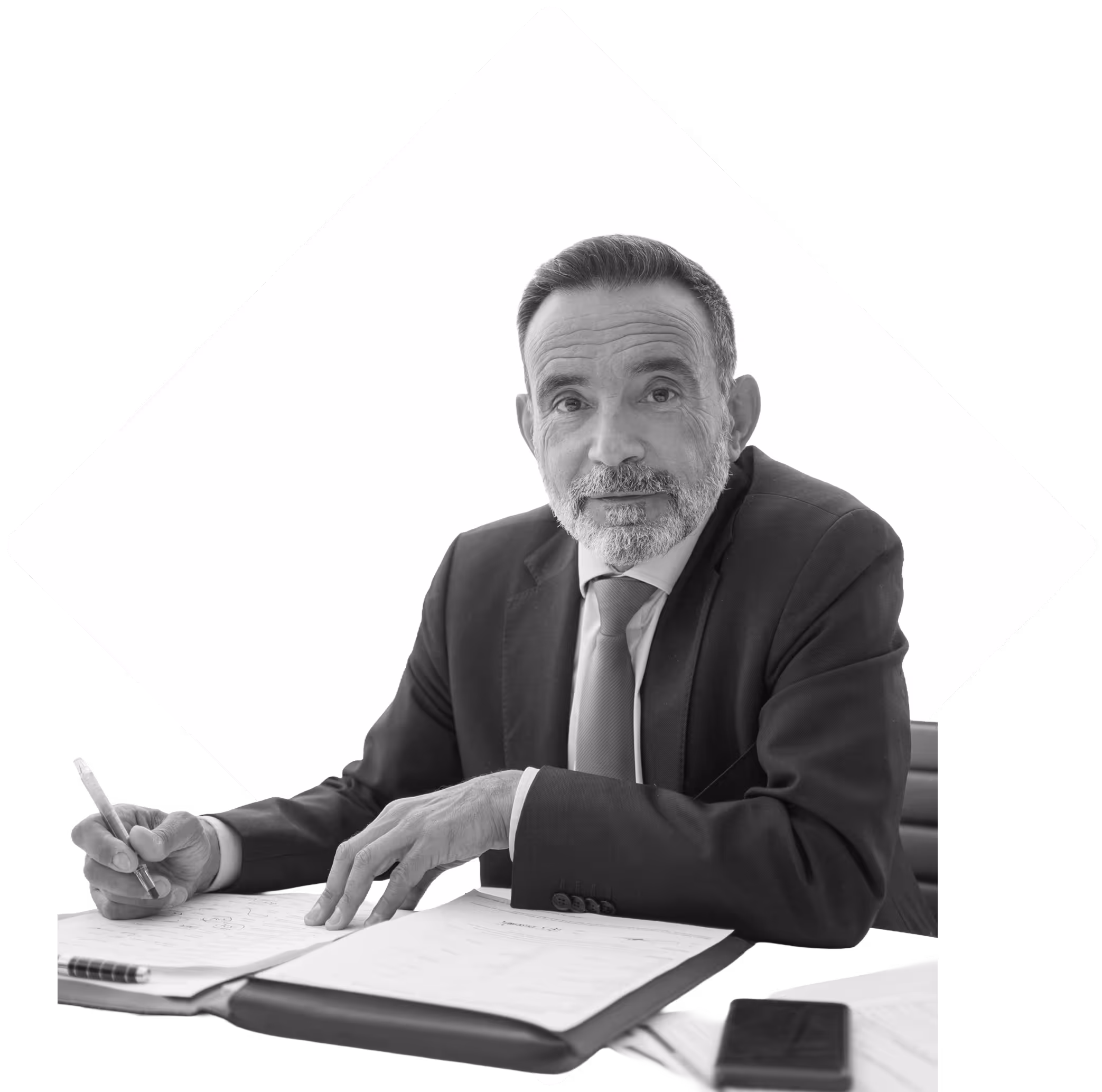 Male lawyer at his desk looking at the camera