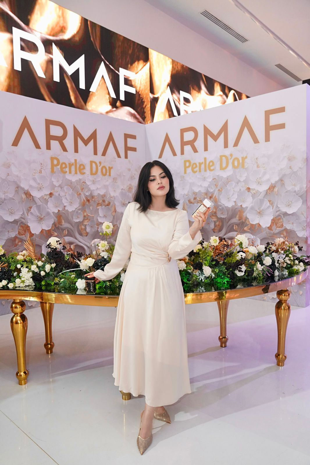 Influencer filming an Instagram Reel at an ARMAF perfume launch event in the UAE
