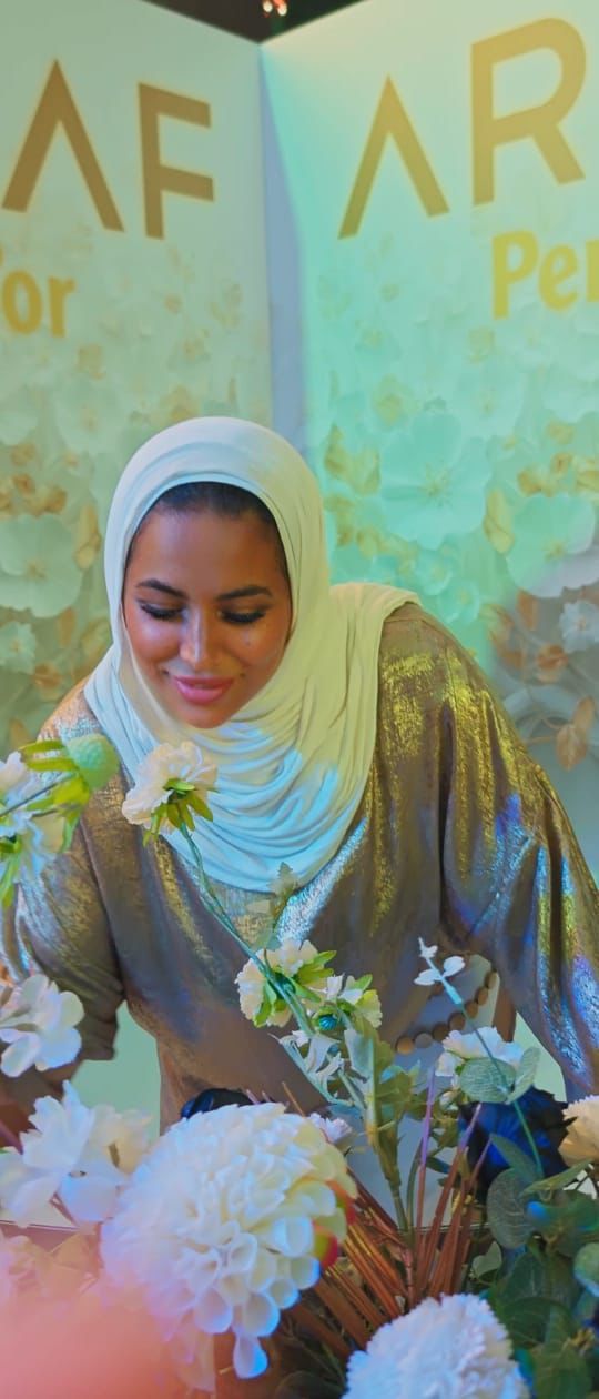 Influencer filming an Instagram Reel at an ARMAF perfume launch event in the UAE