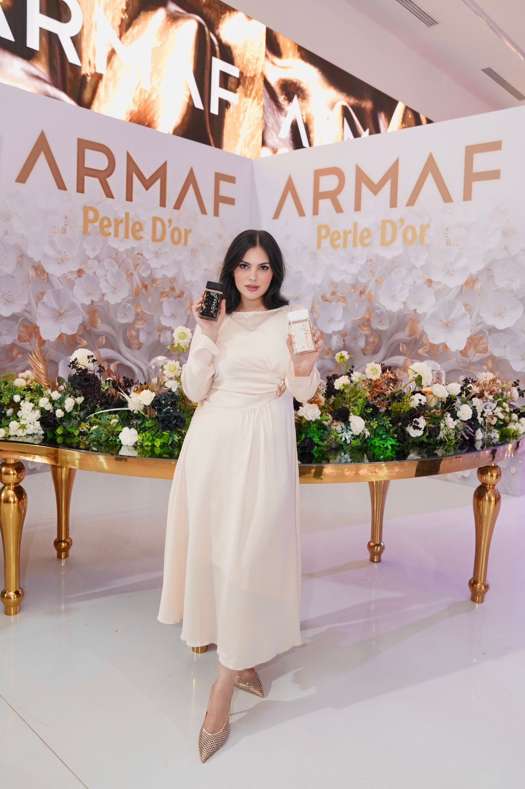 Influencer filming an Instagram Reel at an ARMAF perfume launch event in the UAE