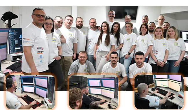 Freight Bridge logistics team working in-office with dispatch systems and multi-screen workstations