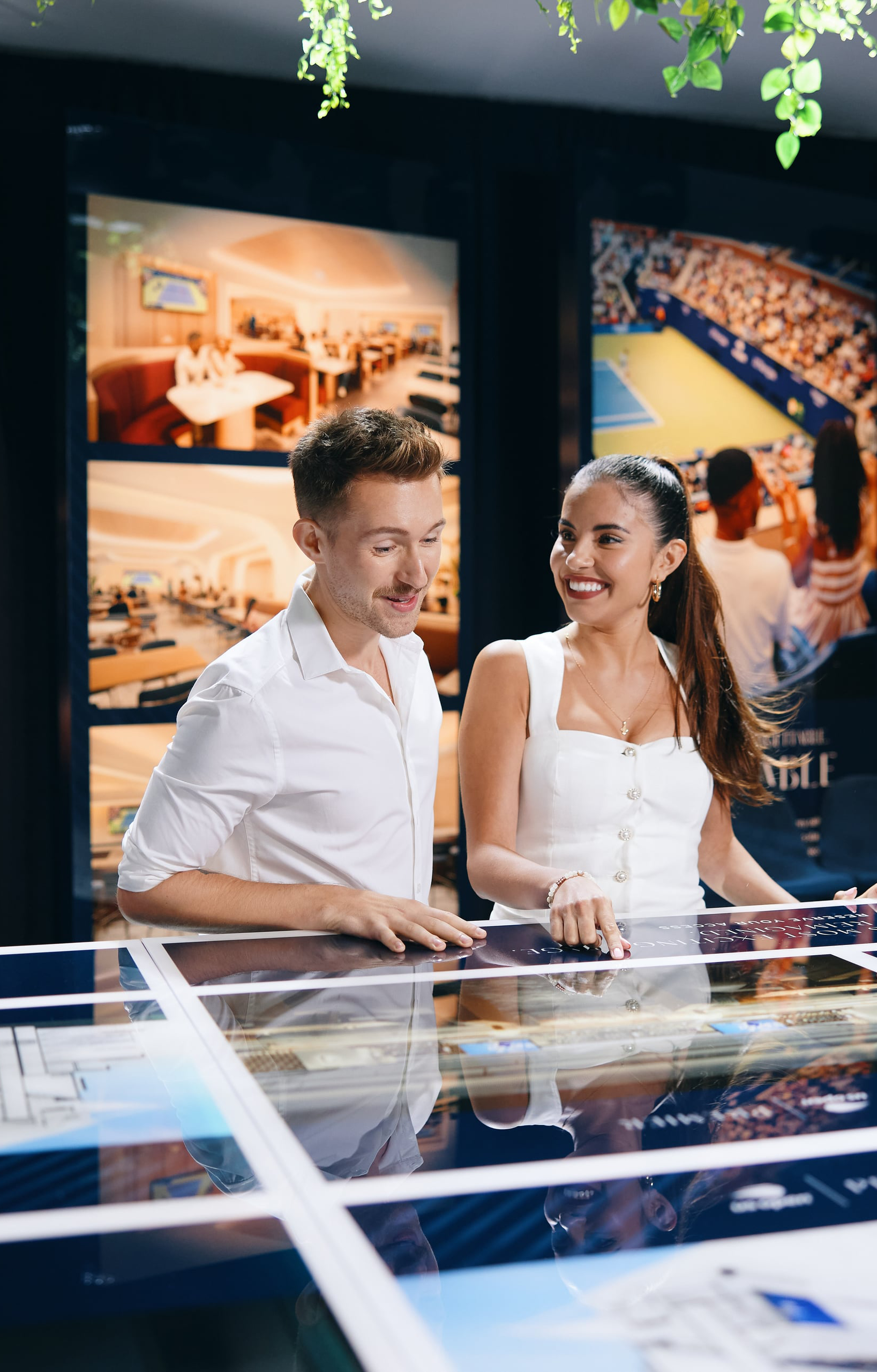 Rendering of an outdoor circular courtyard with tables, chairs, and a central planter beneath a slatted canopy