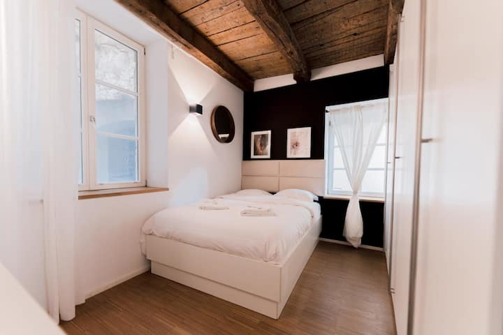 Bedroom with double bed, wardrobe and natural light, 1BR Old Town Luxembourg