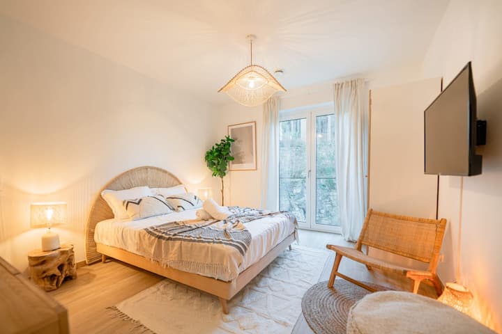 Cozy seating corner with armchair, lamp and window, Pétrusse Park area