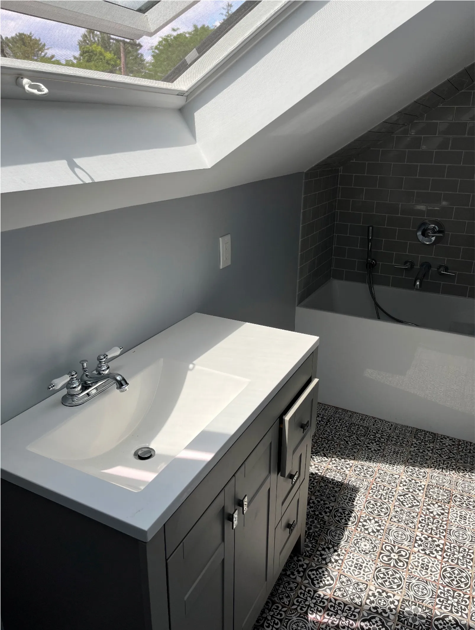 A Veglia Remodeling LLC expert planning a bathroom layout and measuring materials inside a Newburyport, MA home. Bathroom Remodeling near me.