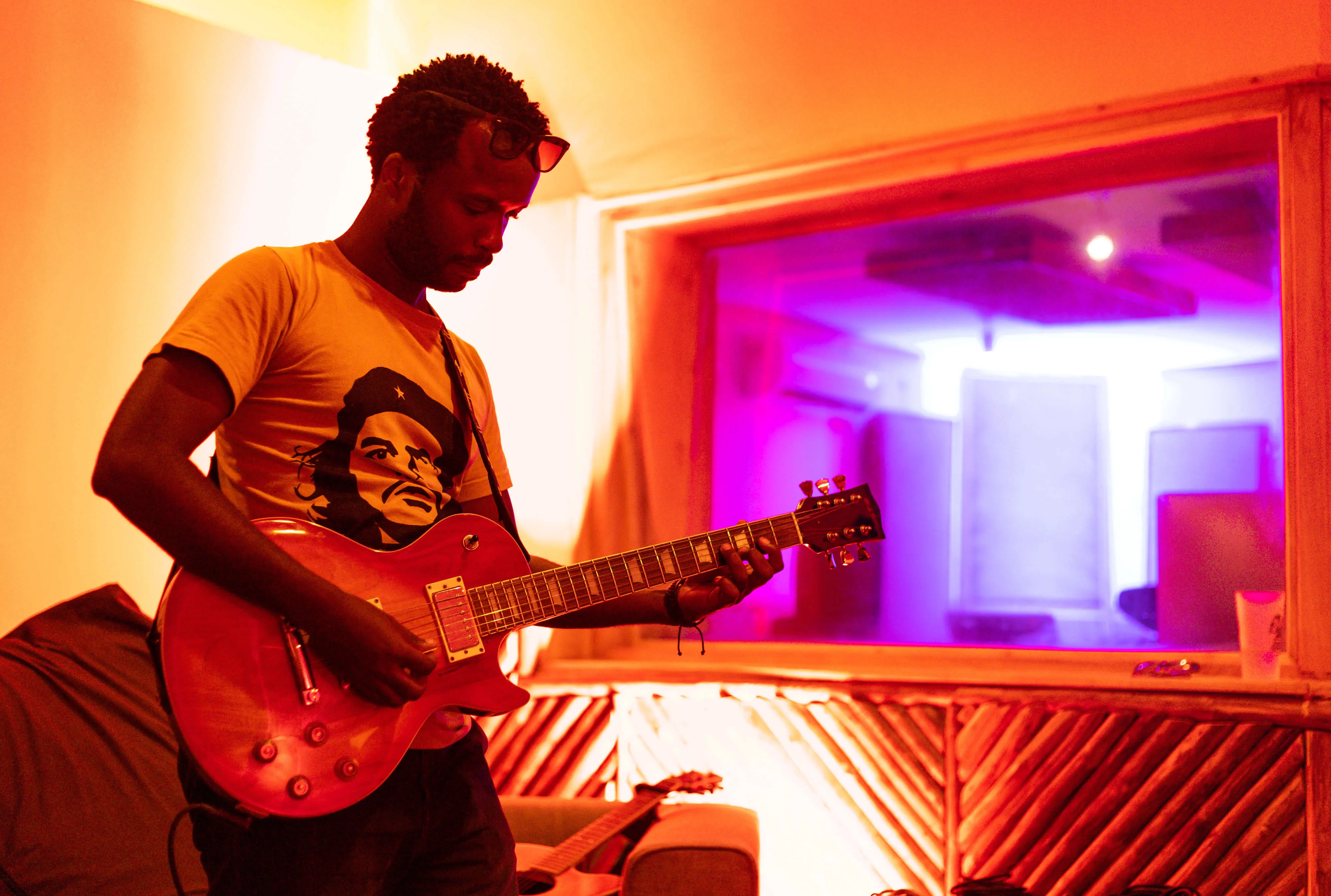 Electric guitar player recording music live at Baobab Studio music studio in Kilifi