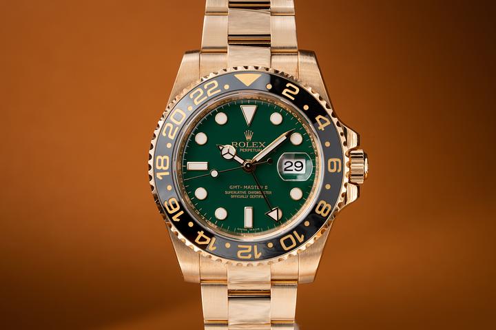 2008 18K YG Rolex GMT-Master II 116718 Green Dial with Box and Papers