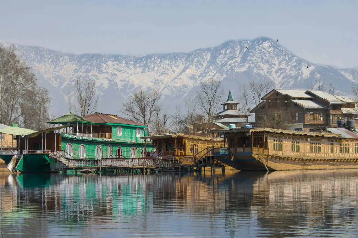 Sukoon Houseboat on Dal Lake with traditional Kashmiri wood interiors