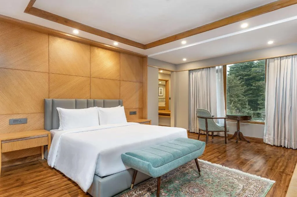 Luxury room at Radisson Golf Resort Pahalgam with mountain views