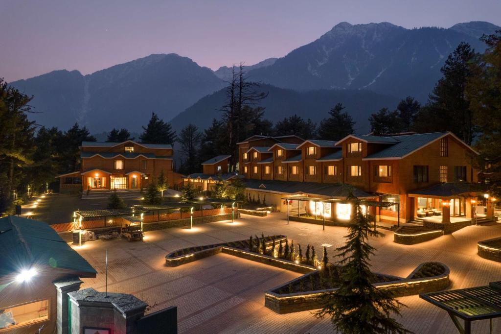 Radisson Golf Resort Pahalgam luxury hotel surrounded by mountains in Kashmir