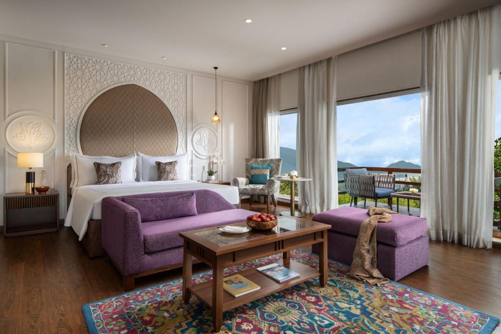 Luxury room at Taj Dal View Srinagar with lake and mountain views