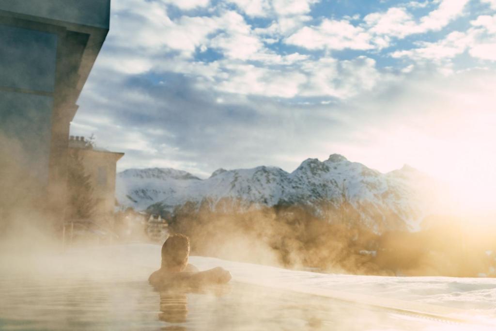 Outdoor heated pool at Kulm Hotel St Moritz mountain resort