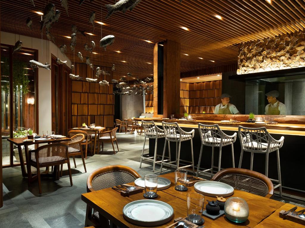 Rocka cliff restaurant at Six Senses Uluwatu sunset — fine dining Bali LocalHi