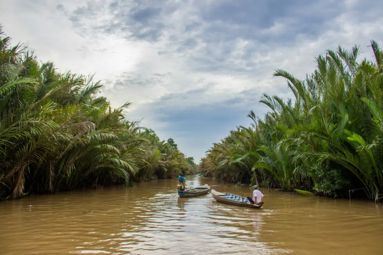 Mekong Delta floating market Vietnam boats and fruits