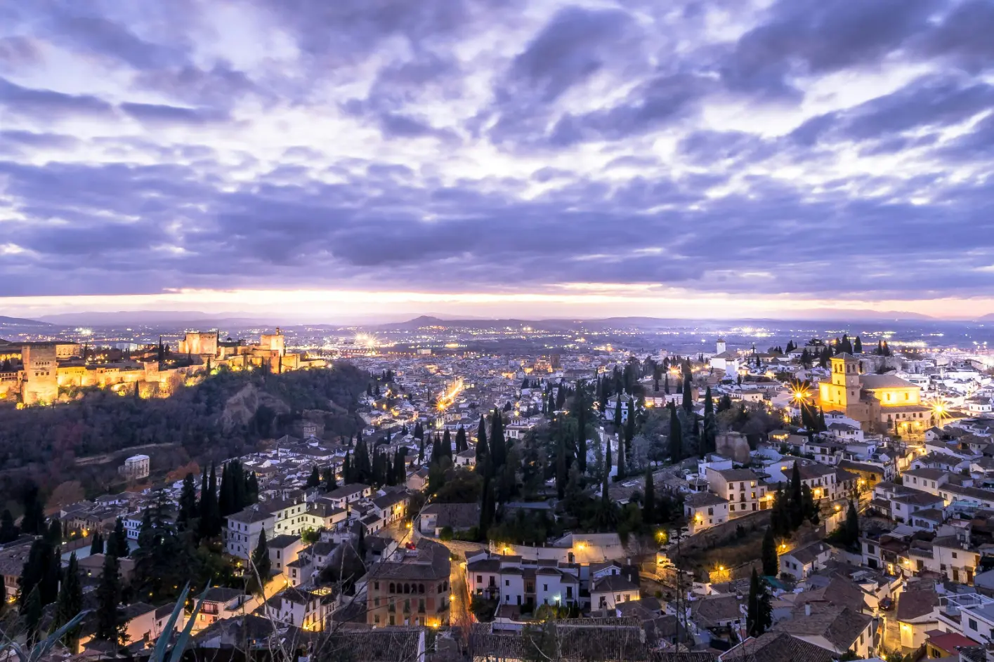 Alhambra Nasrid Palaces night visit Granada illuminated courtyard