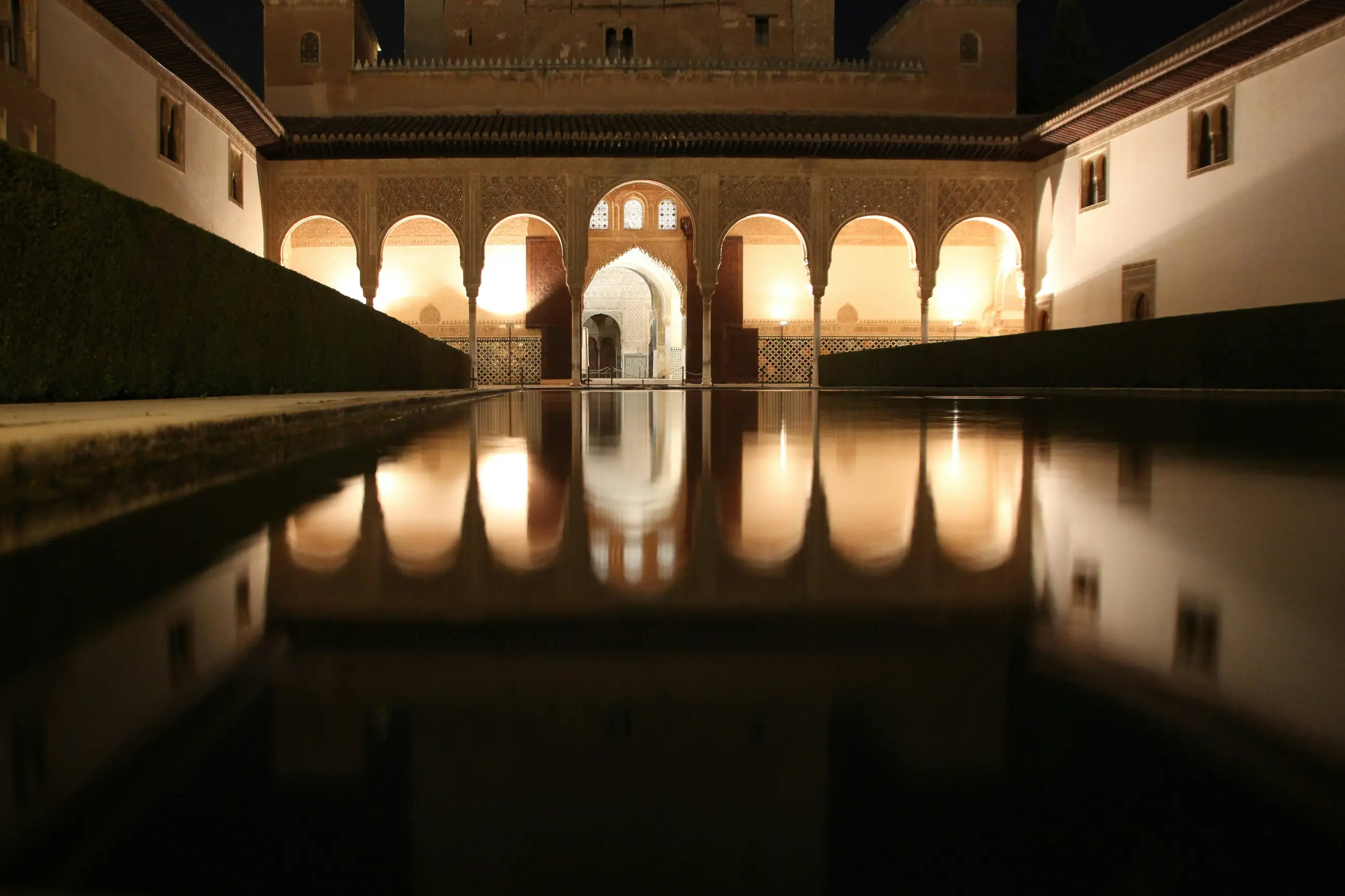Alhambra Granada night view palace walls and city lights