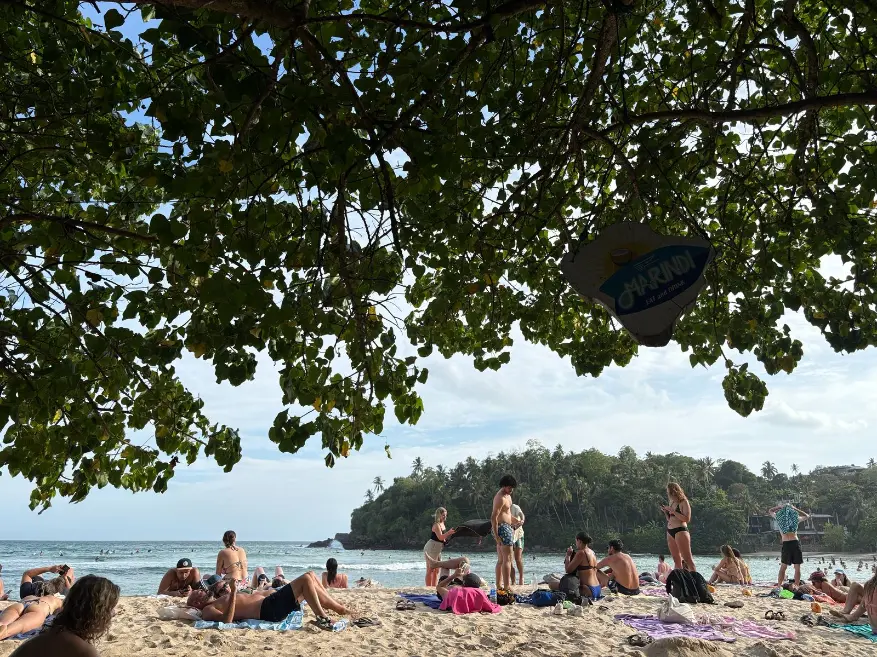 Hiriketiya bay beach Sri Lanka with surfers and travellers
