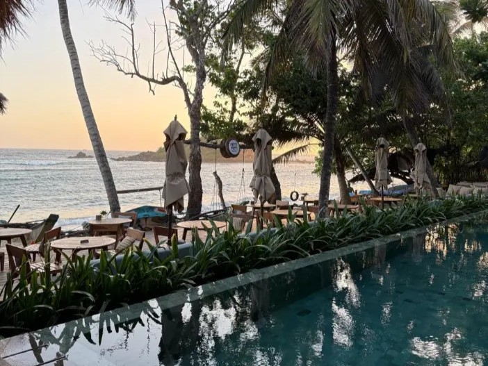 Beachside restaurant pool Sri Lanka south coast sunset
