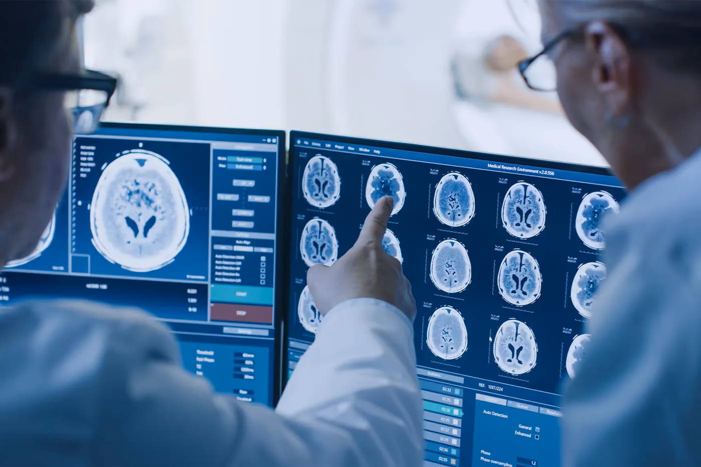 A board-certified neurosurgeon in Los Angeles studies a patient’s brain scan results
