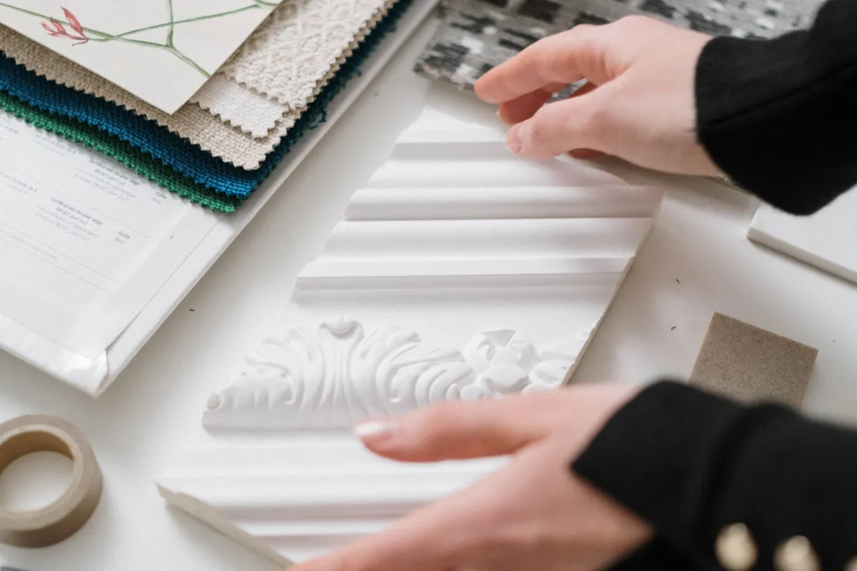 Interior designers hands touching selections