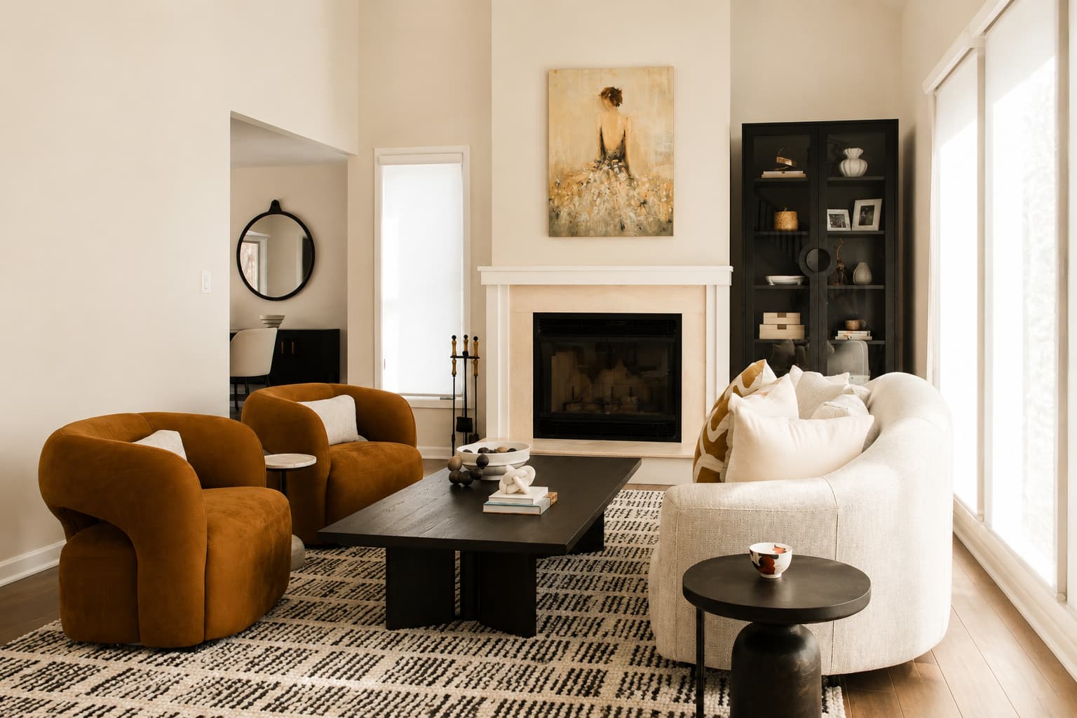 Family room interior design showing well-placed single chairs alongside a longer sofa